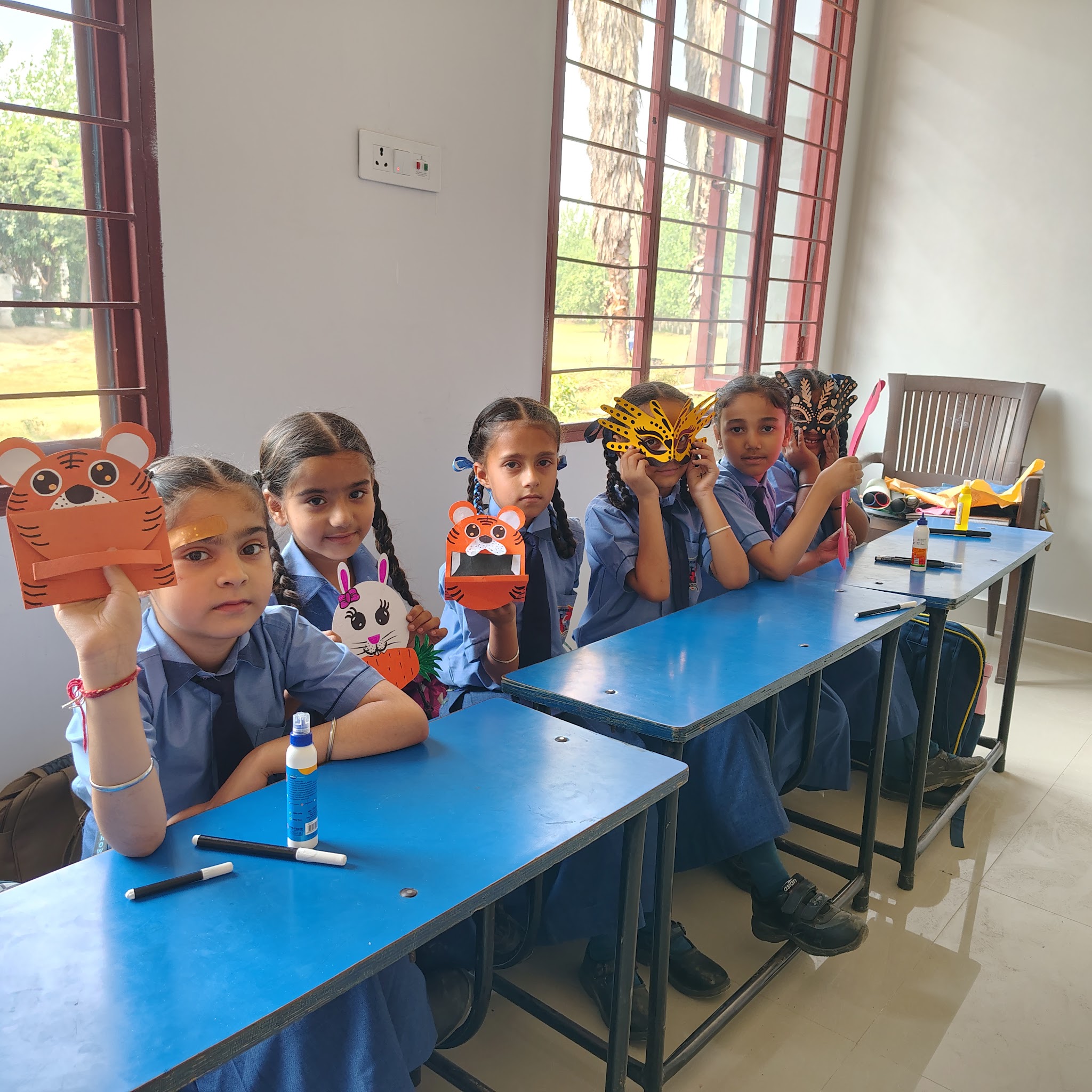 Primary students with their craft projects